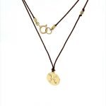 14 Karat Gold Pisces Zodiac Charm On Brown Silk