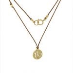 14 Karat Gold Capricorn Zodiac Charm On Light Brown Silk