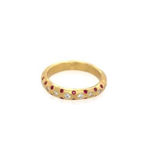 Gold ring adorned with red rubies and sparkling diamonds, featuring a textured design for added elegance. Perfect for special occasions or everyday wear.